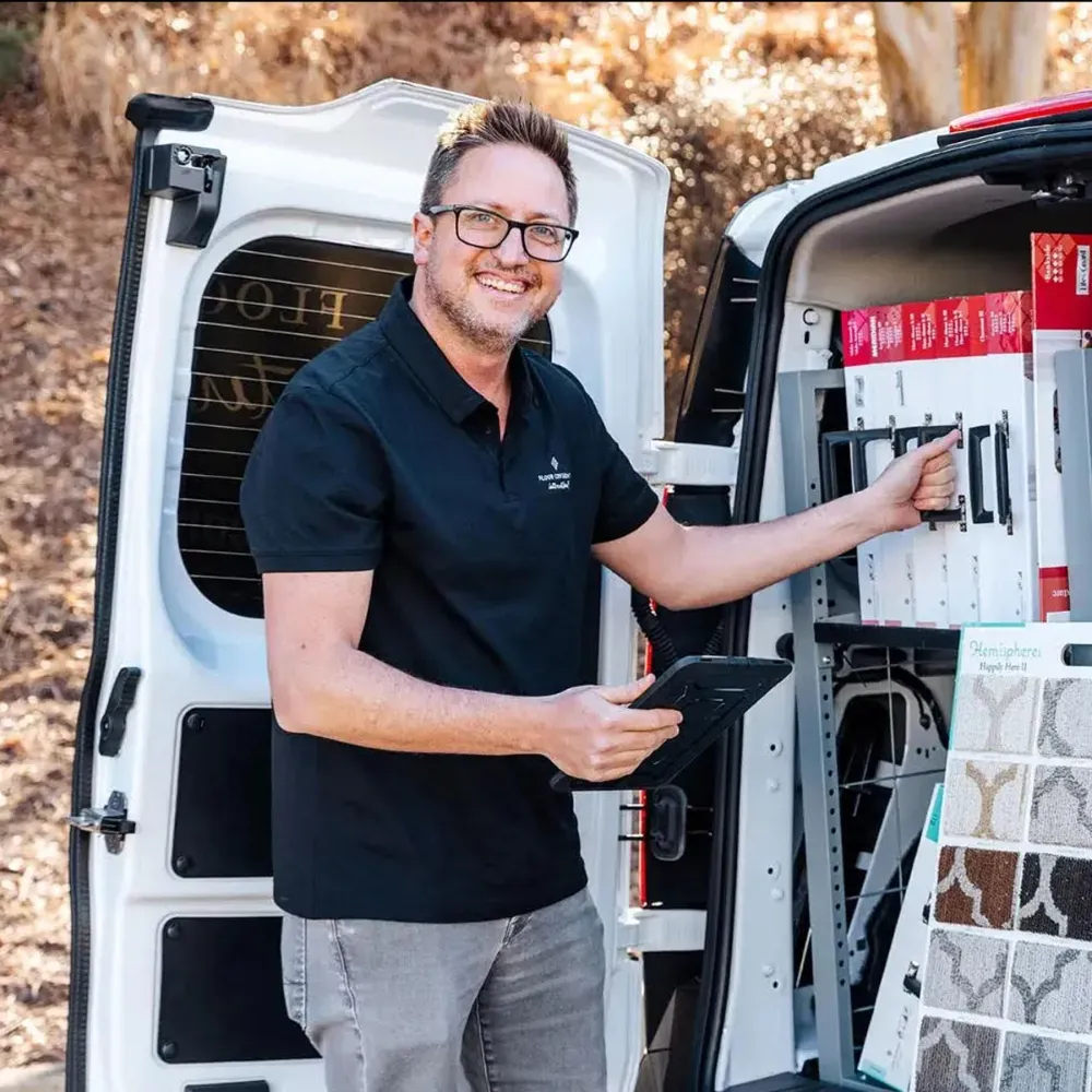 Emplyee standing in front of van