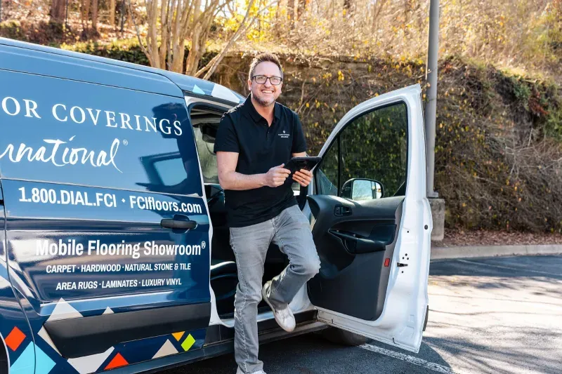 Employee standing in front of van